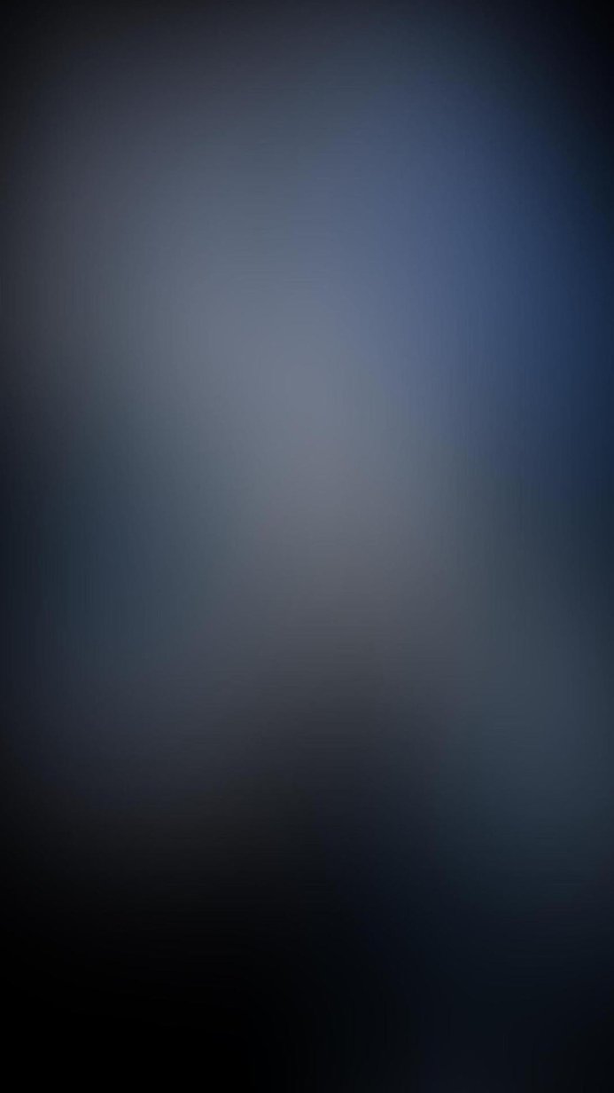 Abstract gradient background in shades of blue, gray, and black