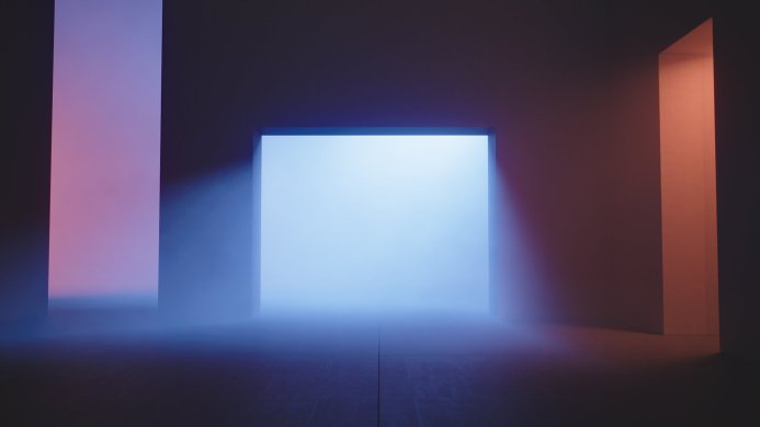 Abstract image of a doorway surrounded by columns with blue, orange, and purple lighting