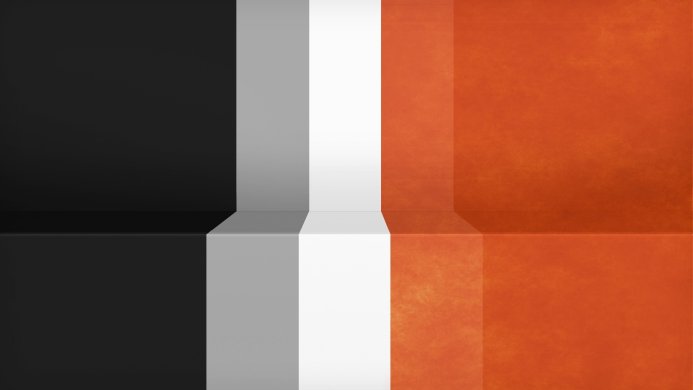 Abstract image with black, grey, white, and orange blocks in a geometric pattern