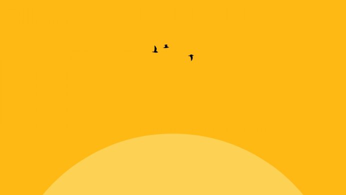 Silhouette of birds flying over a sunset in a yellow sky