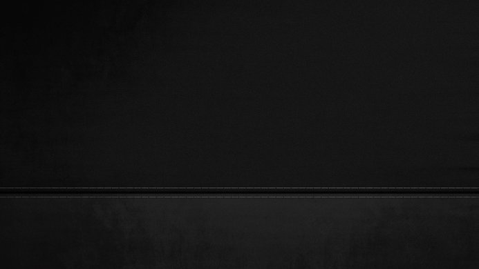 Black fabric background with a simple stitched seam
