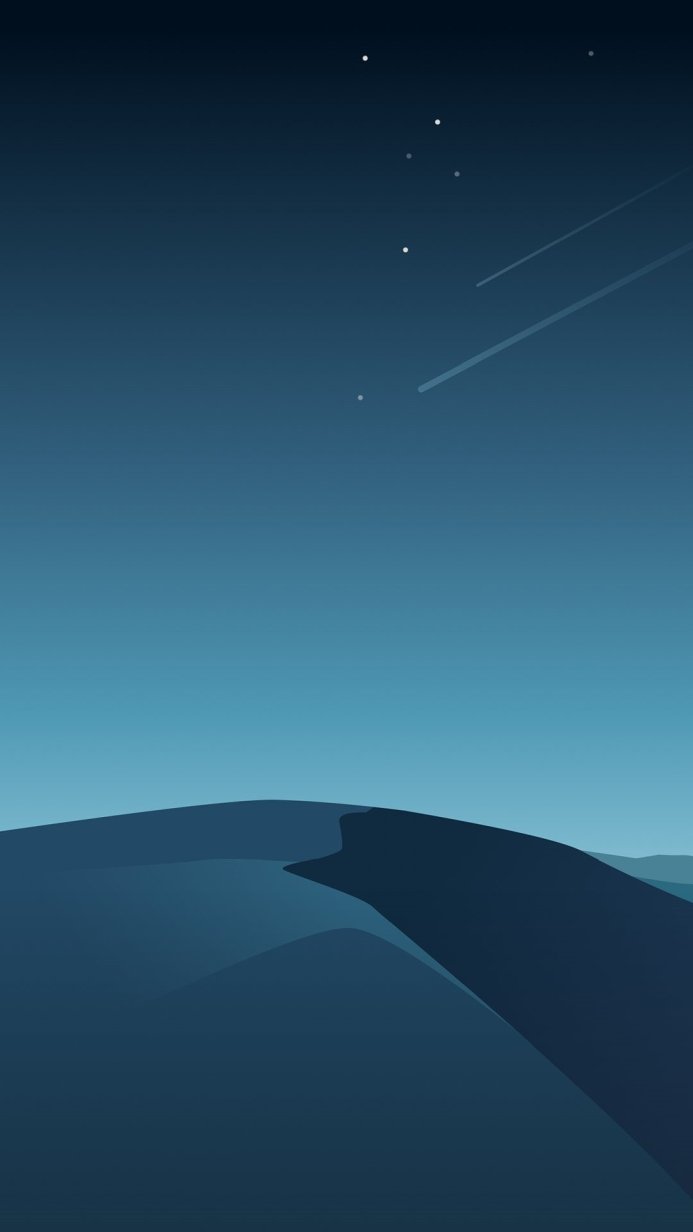 Blue desert landscape at night with stars and a meteor shower