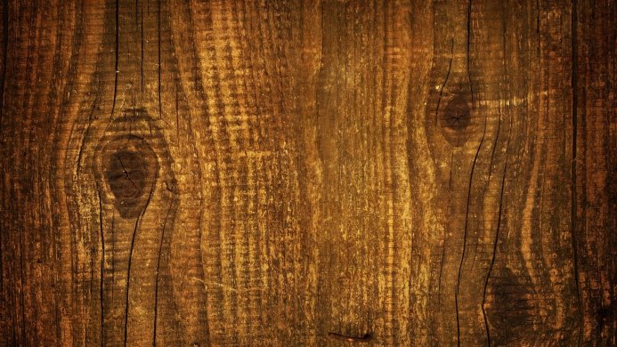Close-up of a detailed brown wood texture with visible grain and knots