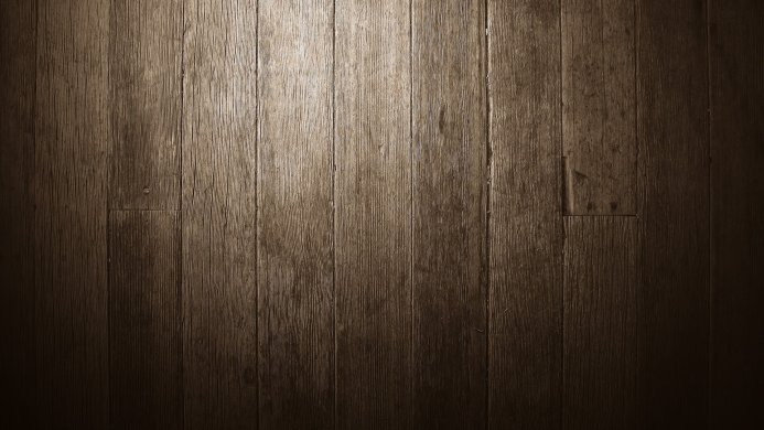 Close-up of a brown wooden floor with visible wood grain patterns