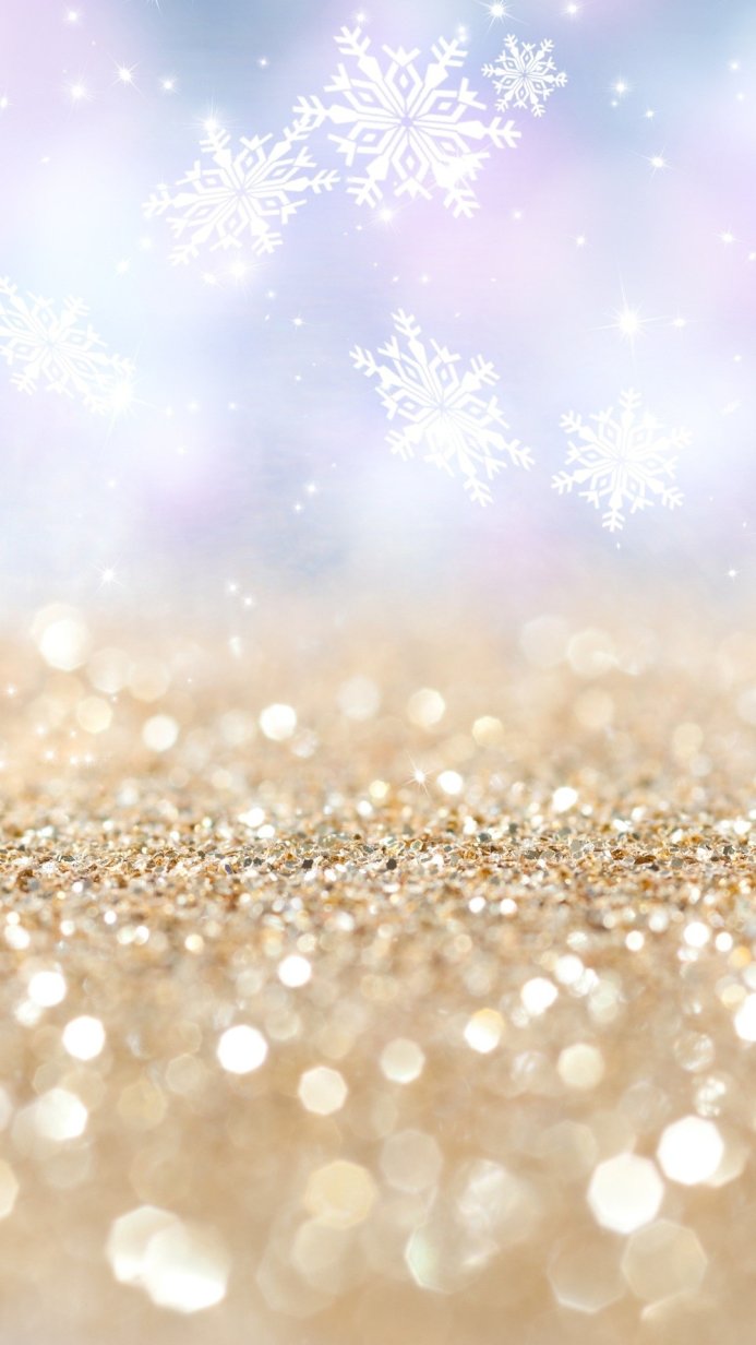 Gold glitter and snowflakes on a light blue background