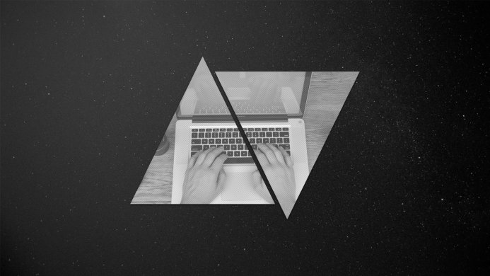 Hands typing on a laptop keyboard against a starry background