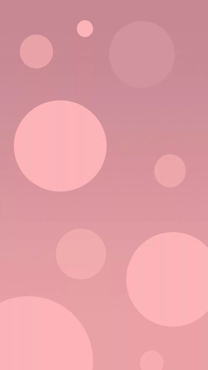 Abstract background with circles of varying sizes in shades of pink