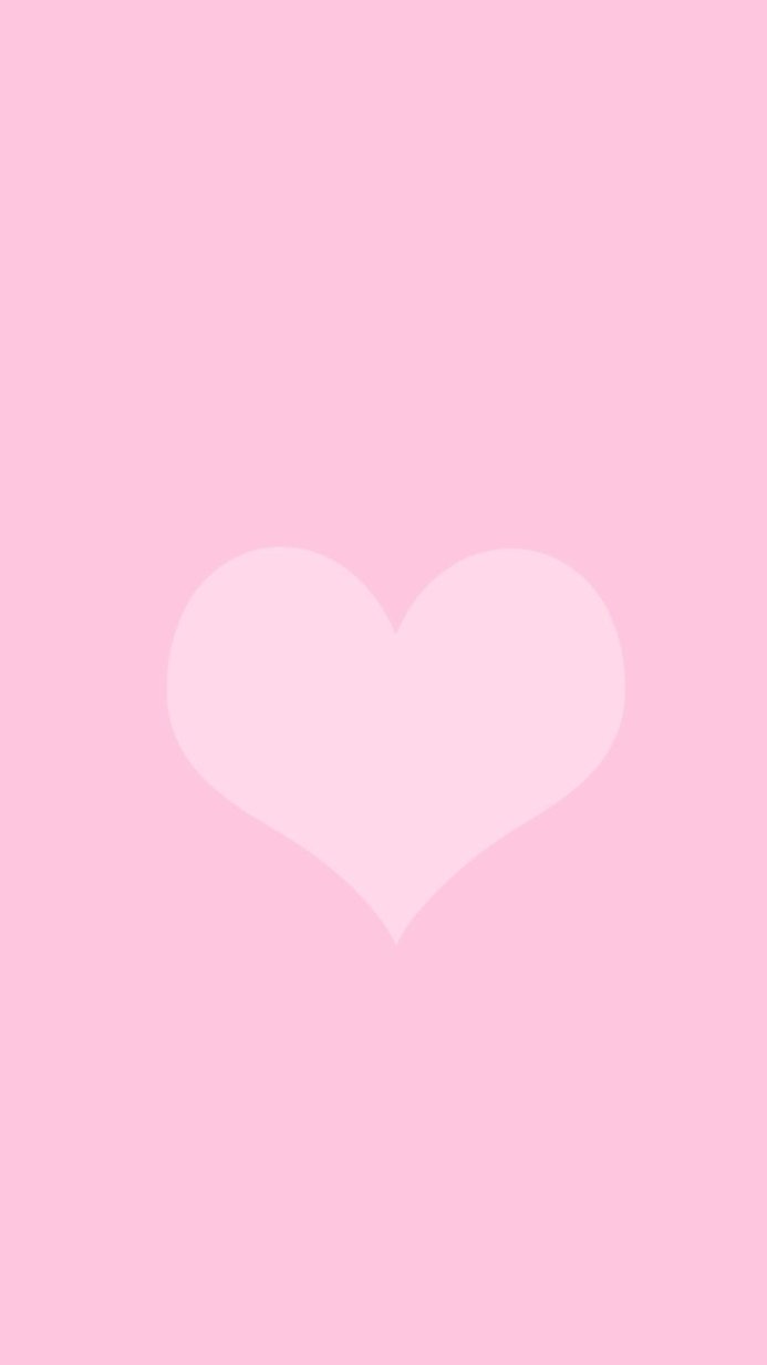 A pink heart on a pink background