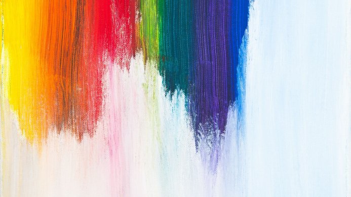 Rainbow colored brushstrokes on white canvas