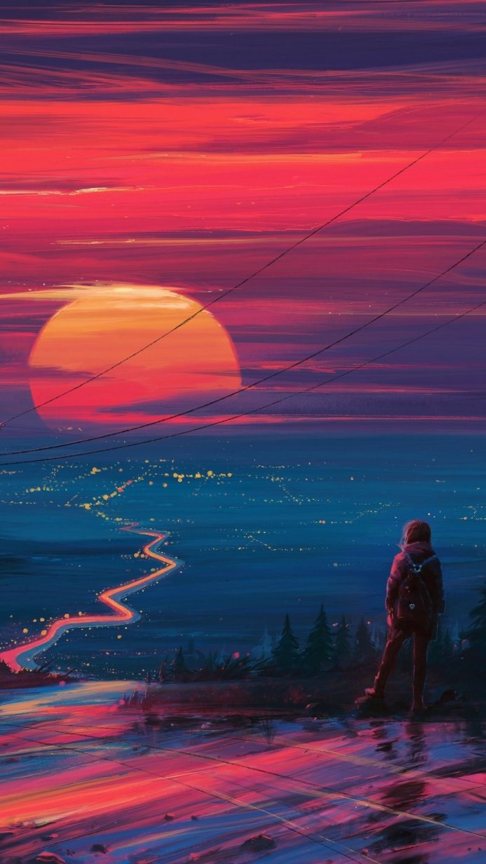 A person watching a sunset over a cityscape reflected in water