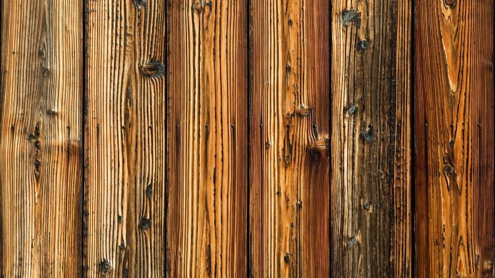 Close-up of weathered wooden planks with a rich grain pattern