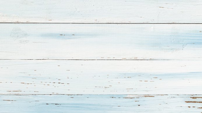 Wooden planks painted in white and blue with visible wood grain