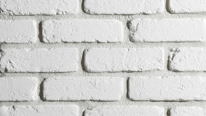 White painted brick wall texture background close-up