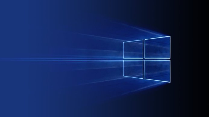 Windows logo on a blue and black background with light rays