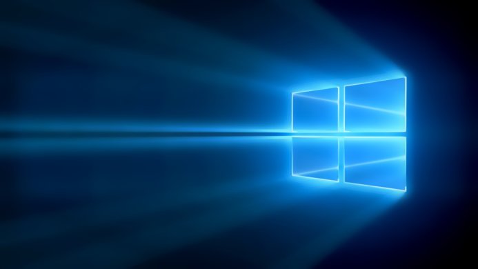 Windows logo in blue with radiating light beams, tech background