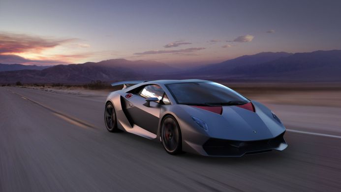 Lamborghini Sesto Elemento driving fast on a desert road at sunset