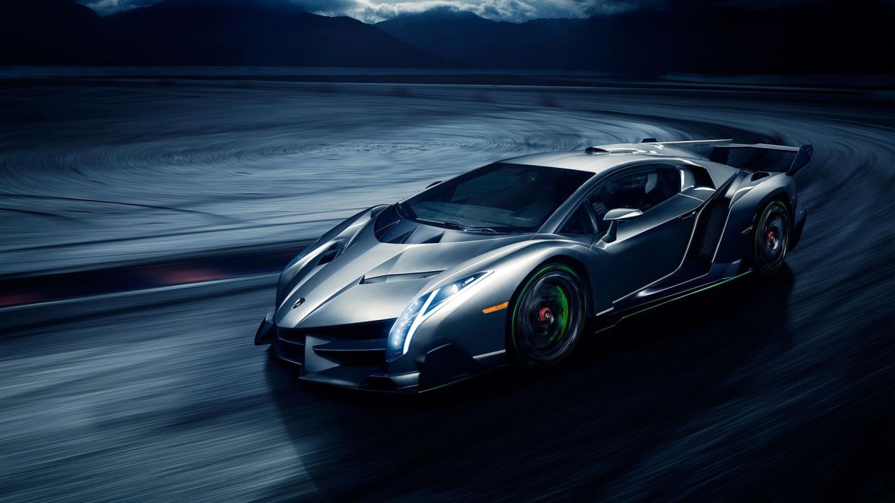 Silver Lamborghini Veneno on a dark road