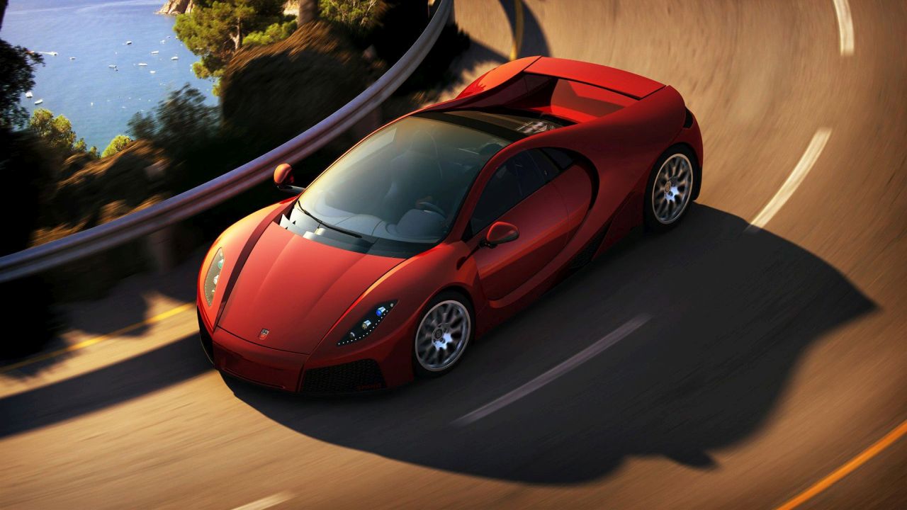 Red sport car on the road