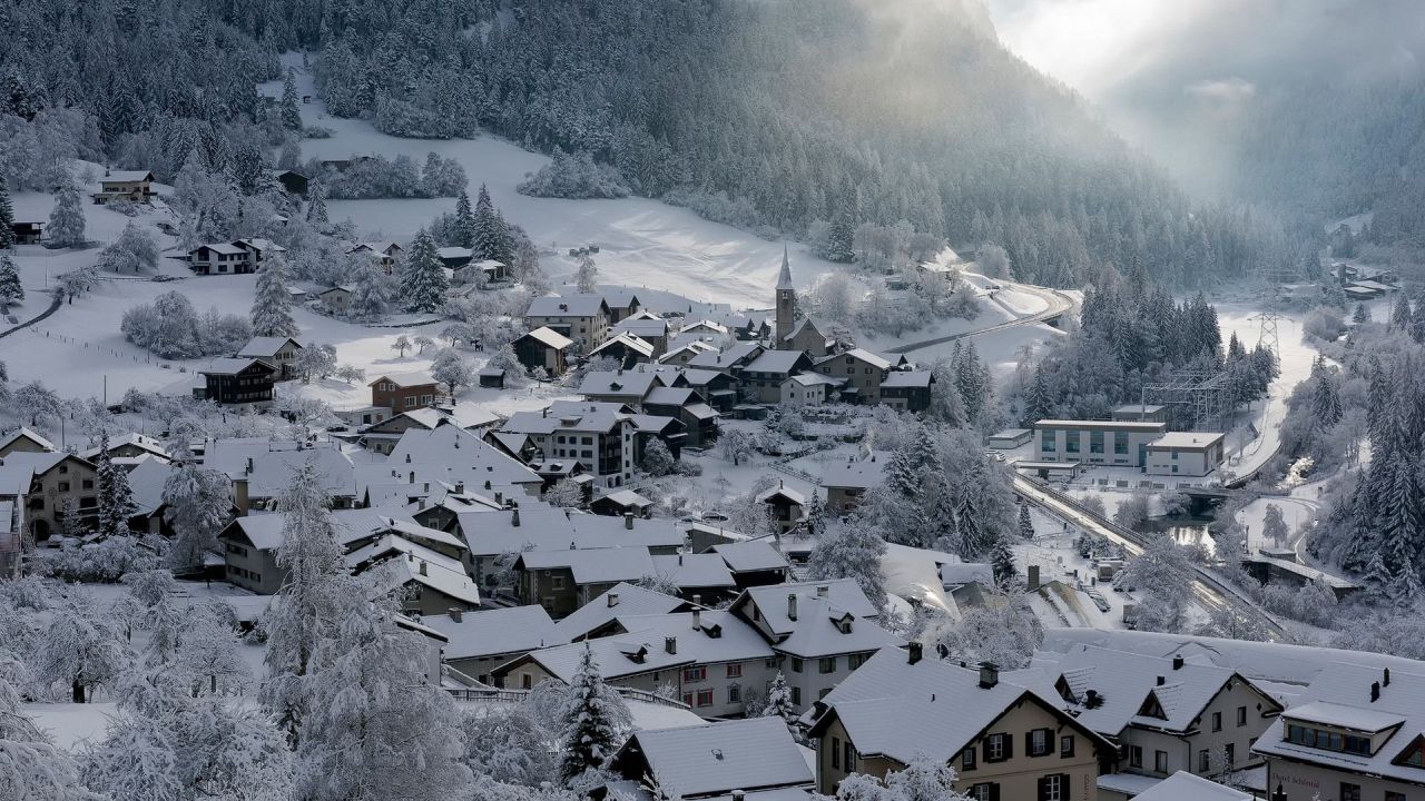 Snow covered village in mountains