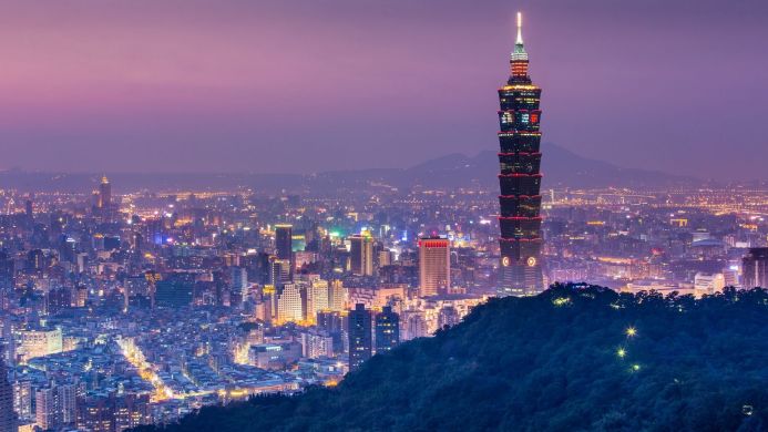 Night view of Taipei 101 skyscraper with cityscape background