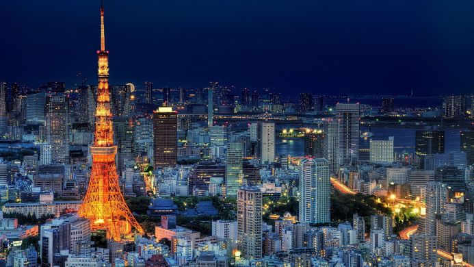 Tokyo Tower at night with city lights in the background
