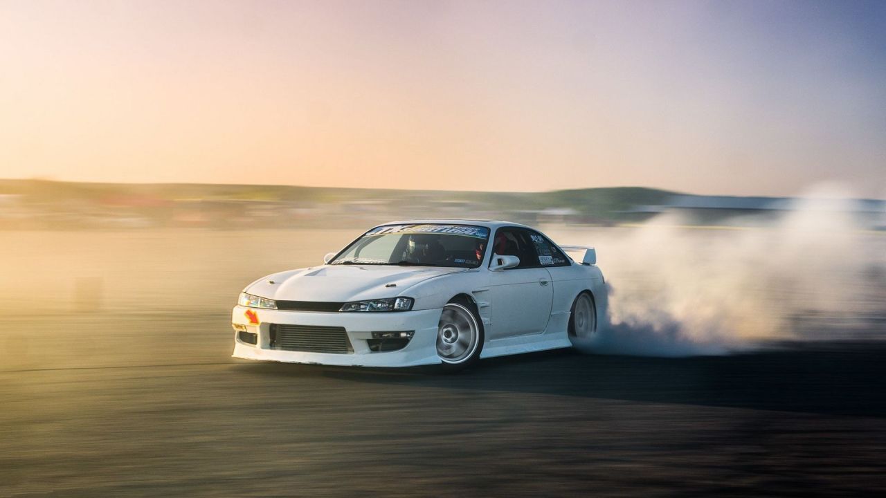 White Nissan Silvia S14 drifting