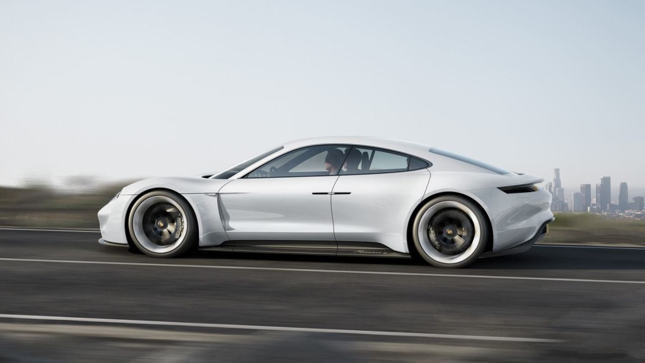 White Porsche Mission E on the road
