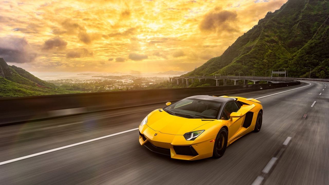Yellow Lamborghini on the road