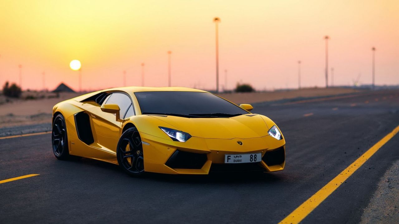 Yellow Lamborghini Aventador on road