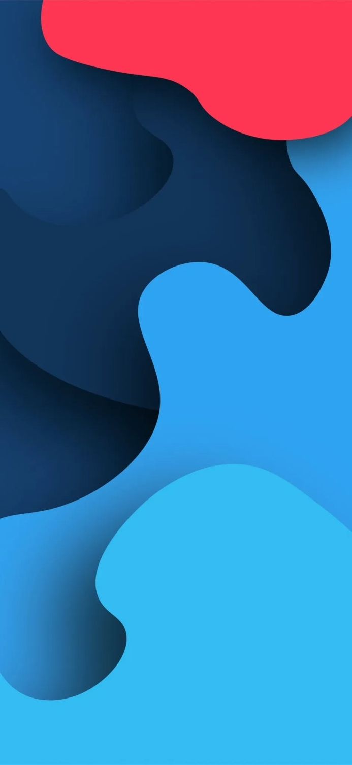 Abstract design featuring overlapping blue and red shapes with subtle shadows