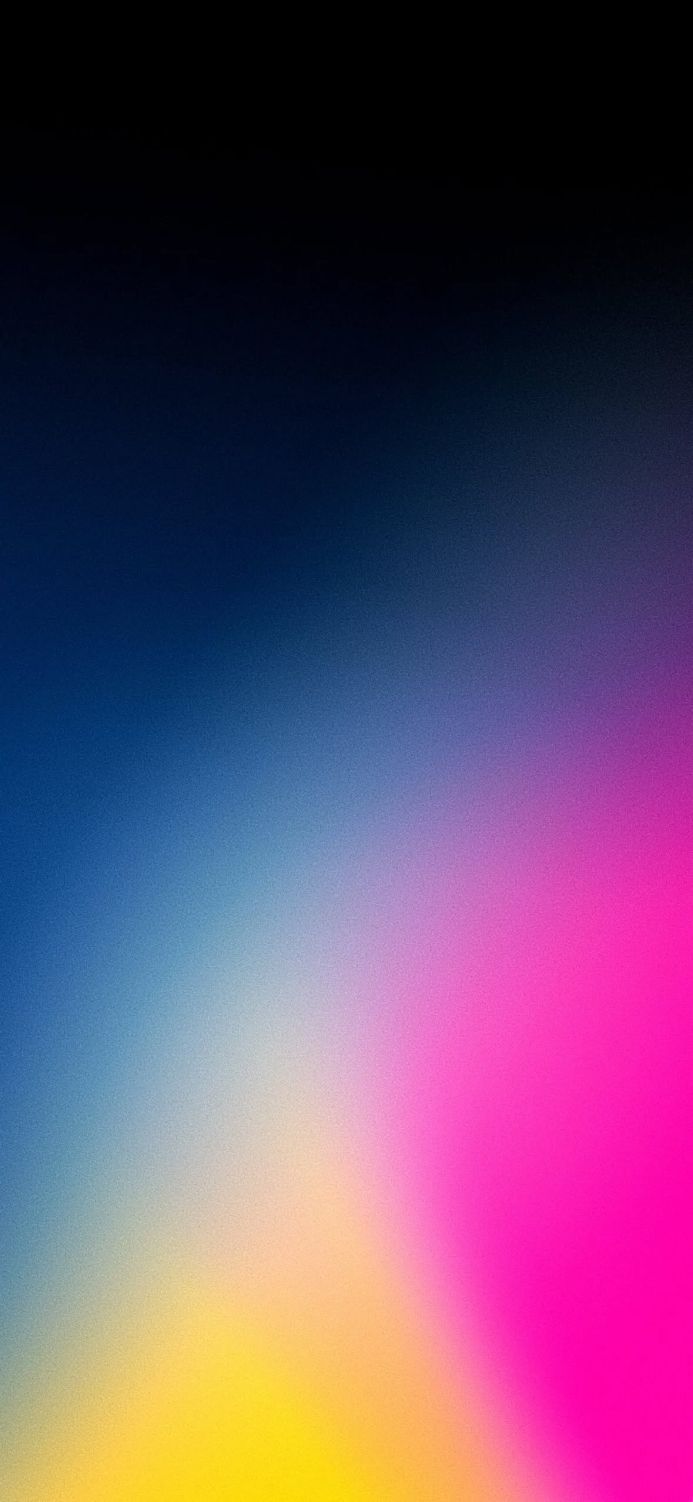 An abstract color gradient from blue to pink to yellow