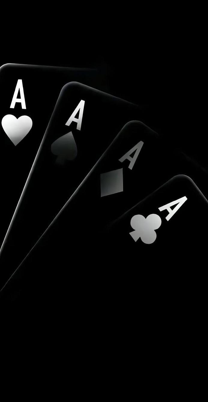 Four aces of playing cards on a black background