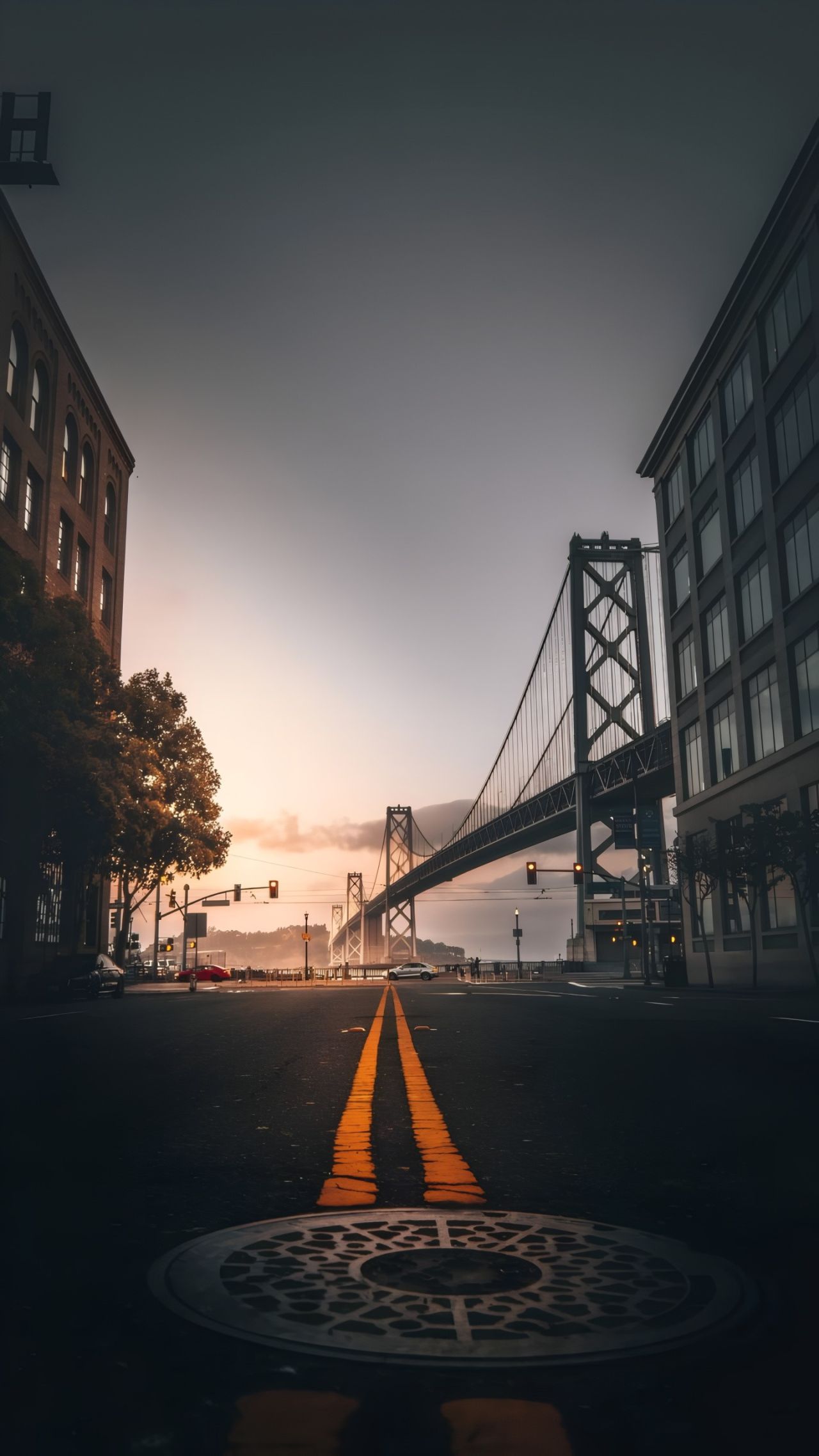 Bridge at dawn with buildings and street
