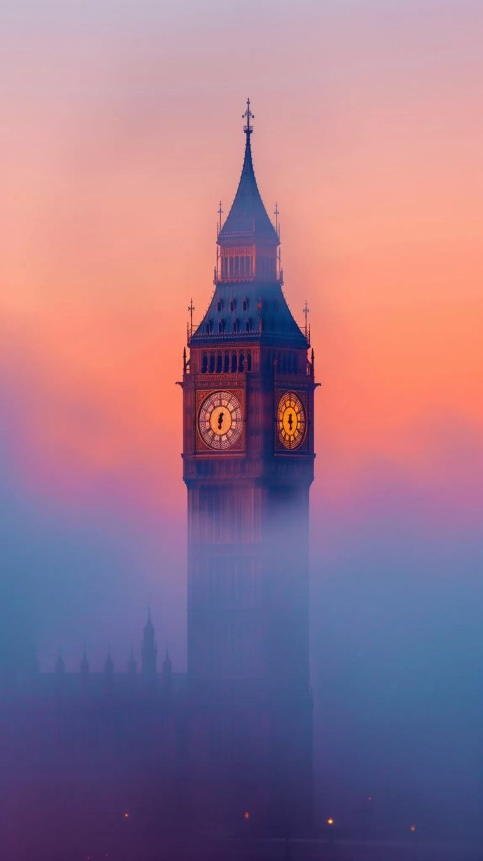 Big Ben clock tower in London with fog at sunset