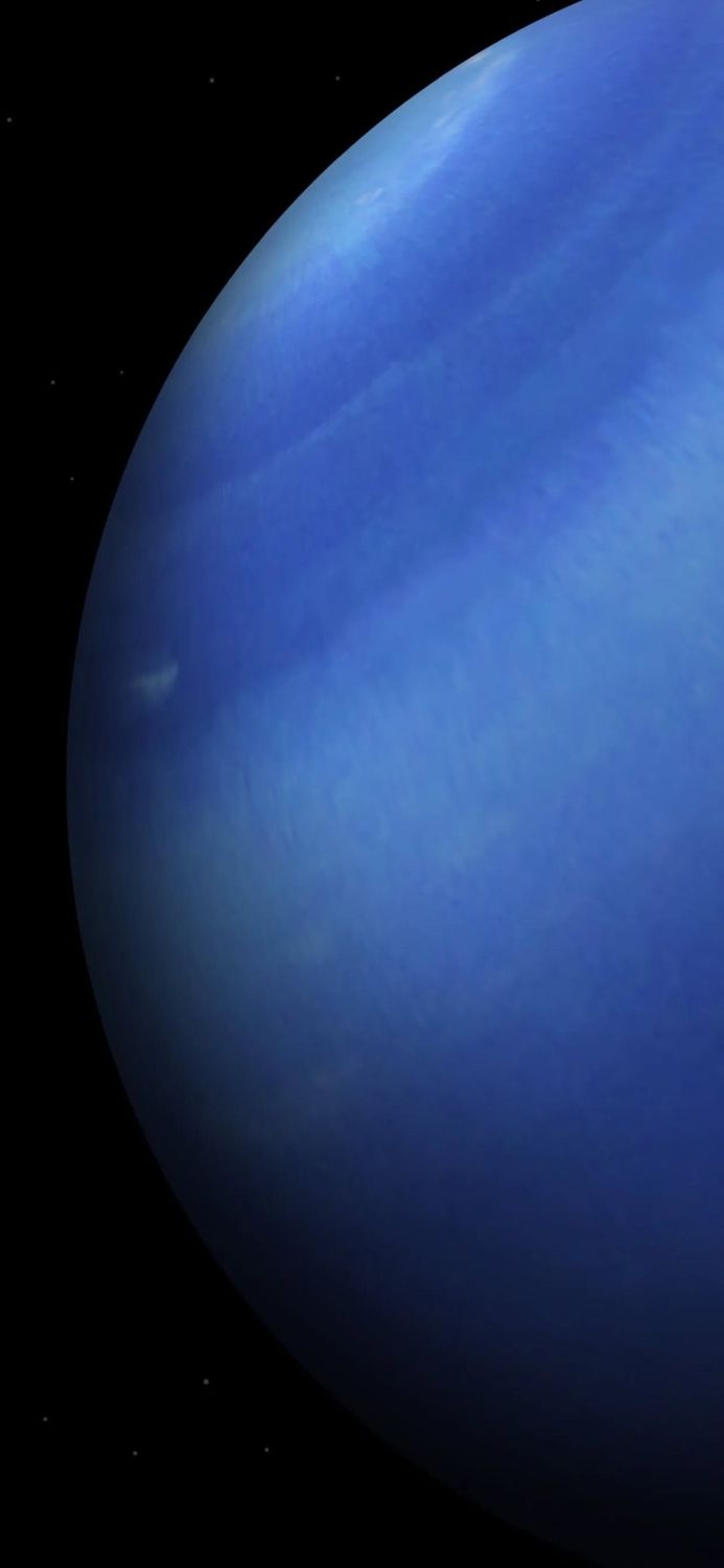 A blue planet in the darkness of space with faint stars in the background