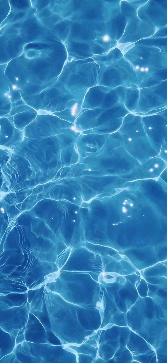 Blue water surface with light reflections