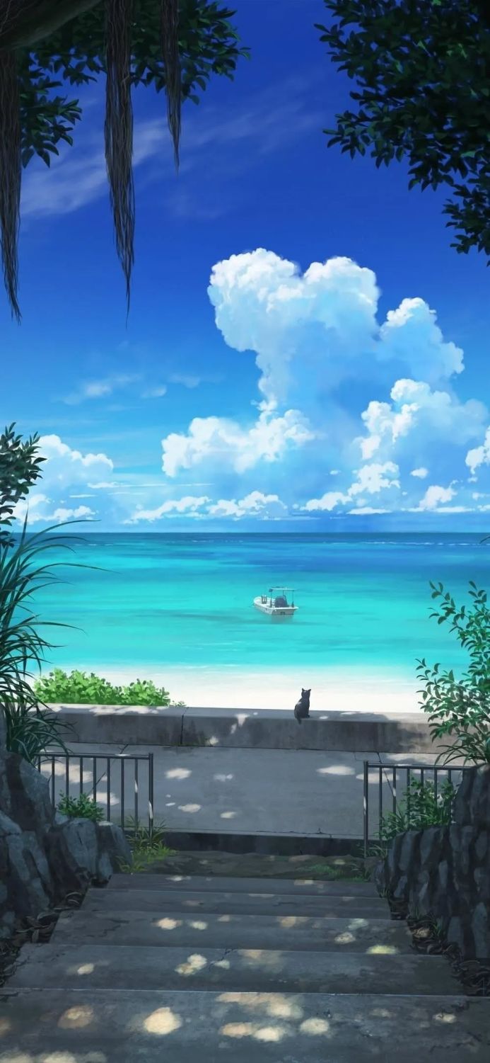 A cat sitting on a wall overlooking a turquoise sea with a boat on a sunny day
