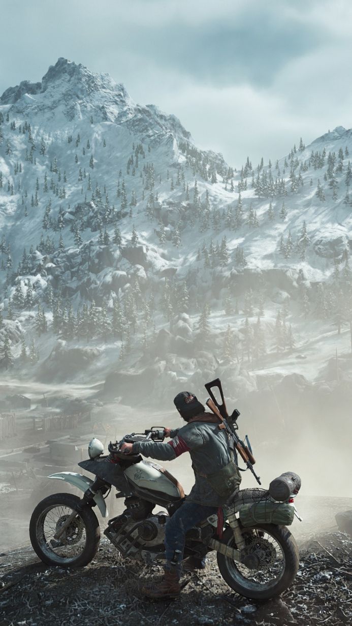 Man on motorcycle with rifle in snowy mountain landscape from Days Gone game