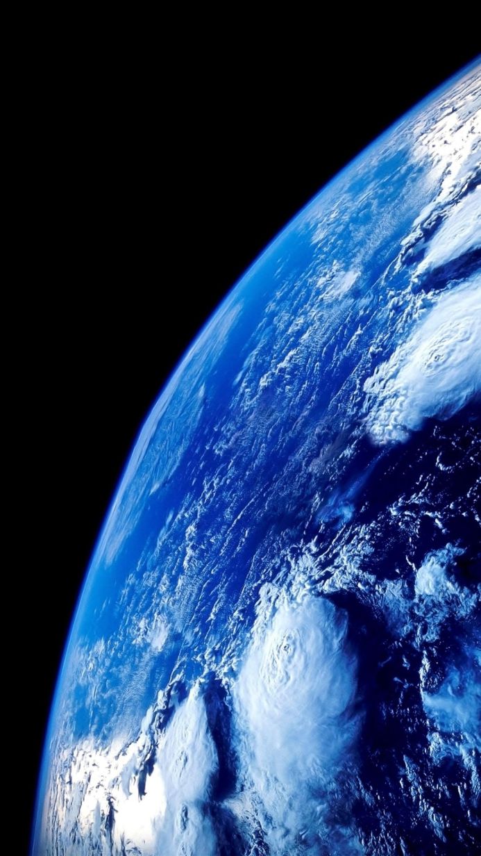 A view of Earth from space, showcasing its blue oceans and white clouds