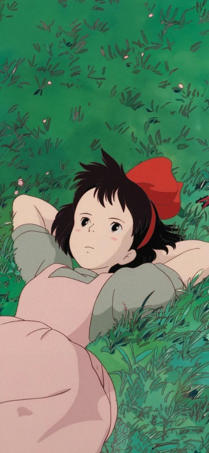 Kiki lying in the grass from Kiki's Delivery Service