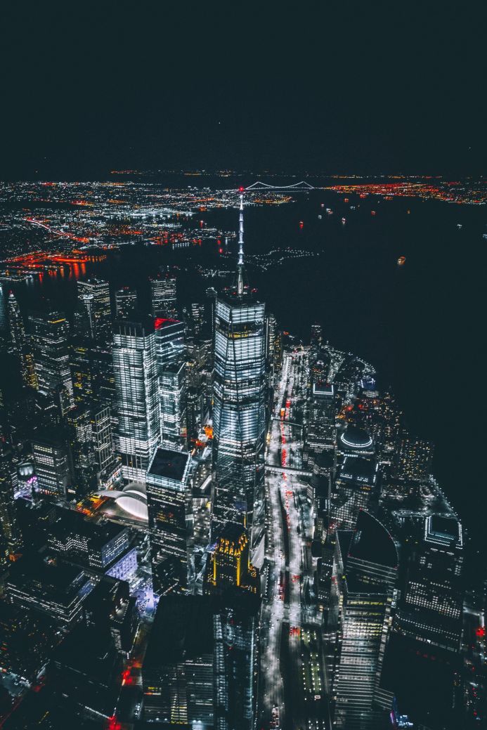 Aerial view of a brightly lit cityscape at night