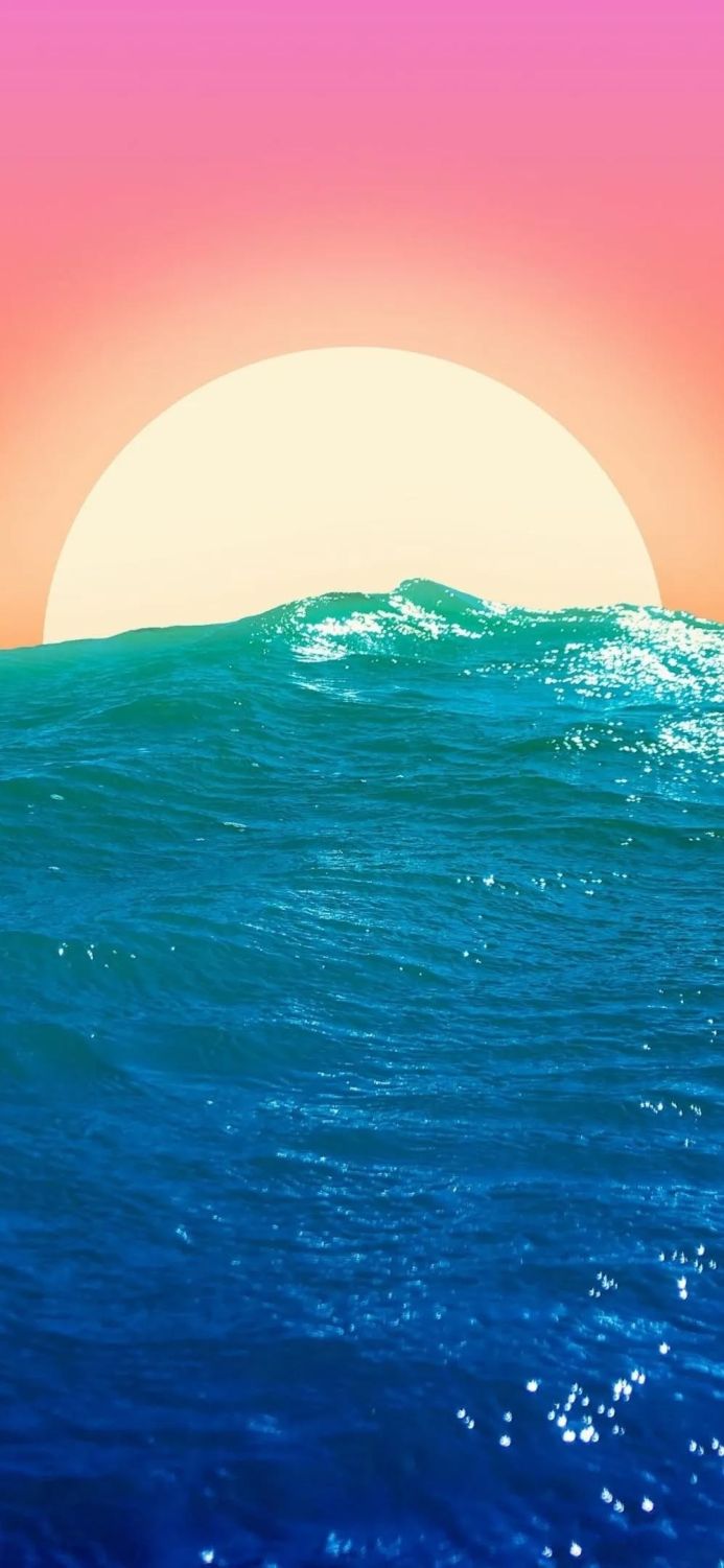 Ocean wave with the sun rising in the background in pink and yellow sky