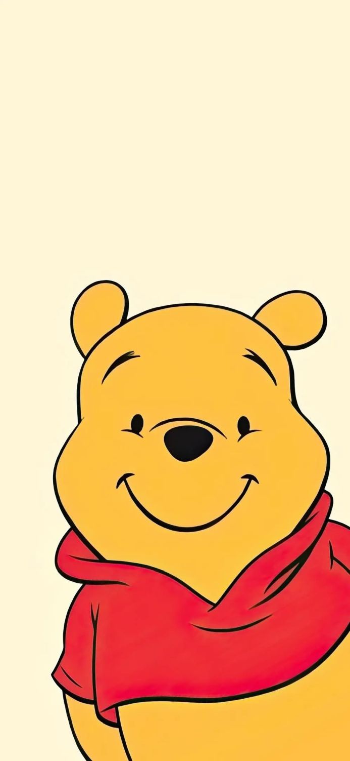 Winnie the Pooh smiling, wearing a red shirt
