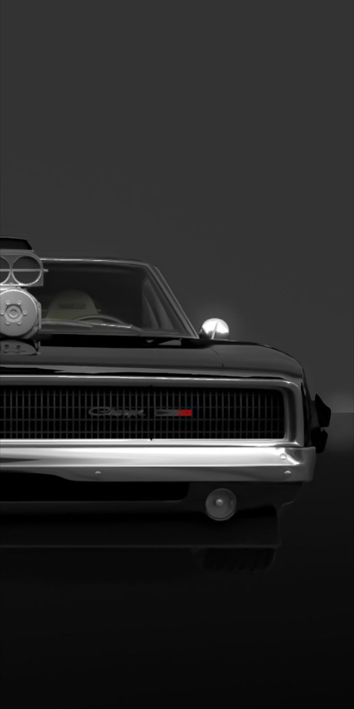 Black 1968 Dodge Charger R/T in a field