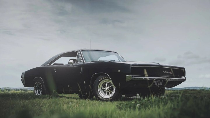 Black Dodge Charger R/T classic car on road