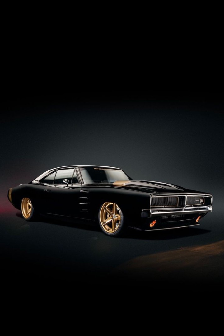 Classic muscle car driving through red dust