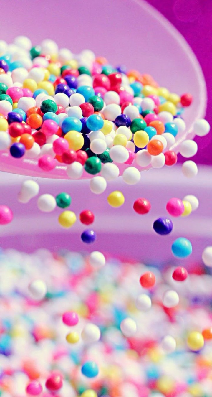 Colorful candy assortment on dark background