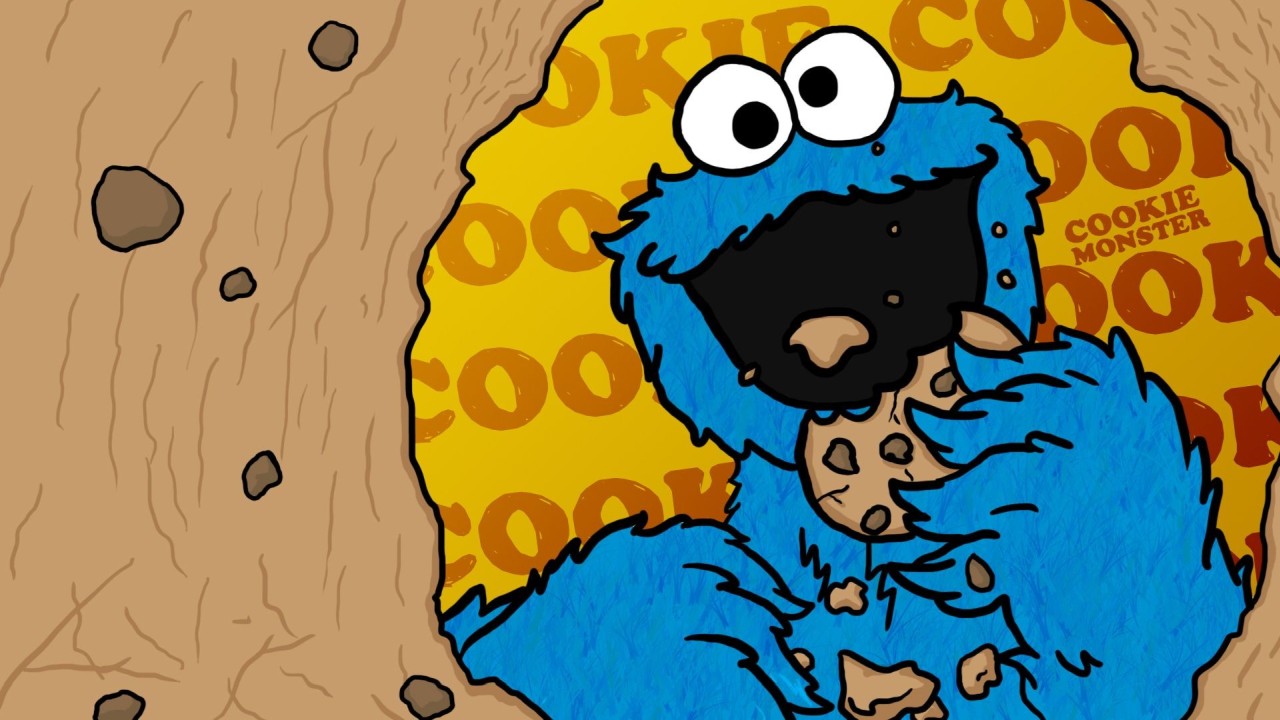 Cookie Monster eating a chocolate chip cookie