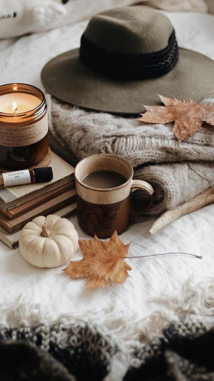 Cozy autumn scene rain window book cup candles