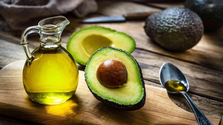 Cut avocado halves on a two color background